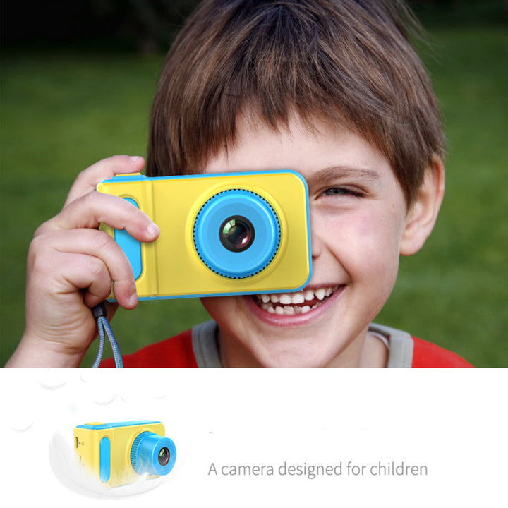 child holding camera, outdoor