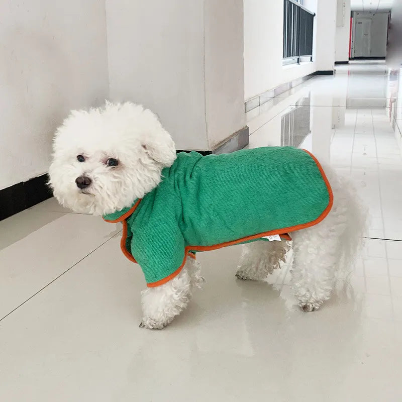 dog in light blue towel robe indoors
