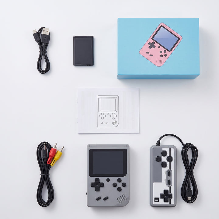 A retro handheld game console kit laid out on a white background, including a gray console and controller, a blue box with a pink console illustration, a USB cable, battery, RCA cable, instruction sheet, and adapter.