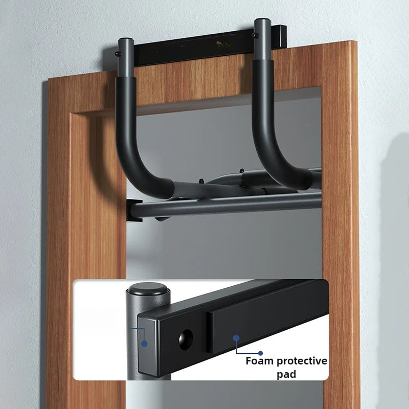 Silver metal pull-up bar with black rubber grips and compact design for easy storage