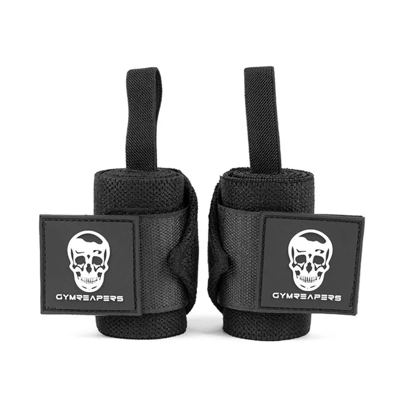Close-up of GymReapers wrist wrap logo – white skull patch on black fabric with reinforced stitching for heavy lifting